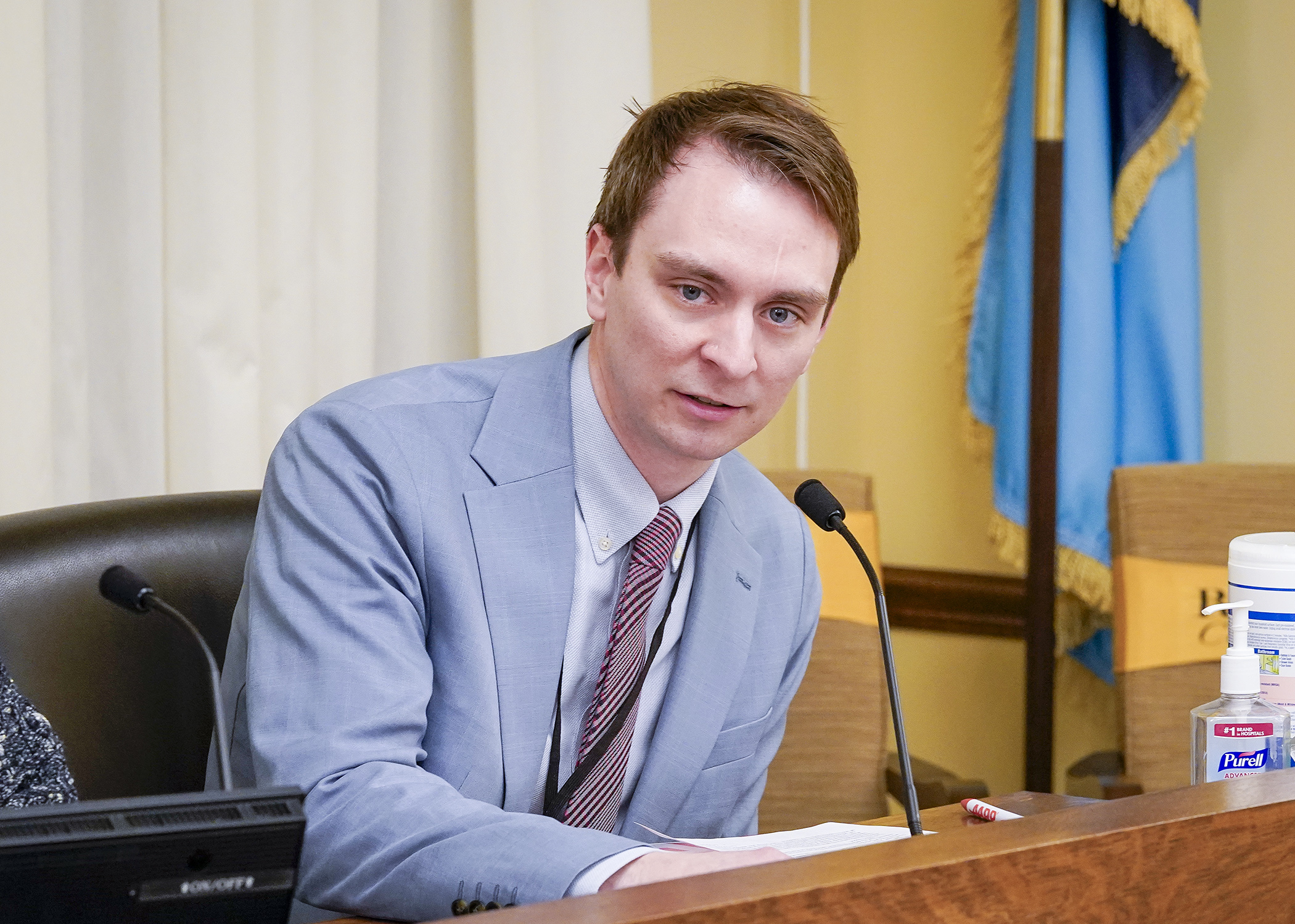 Thomas Elness, Minnesota director of advocacy at AARP, testifies before the House Commerce Finance and Policy Committee Feb. 18 about the implementation and overview of the Consumer Protection Restitution Account. (Photo by Andrew VonBank)